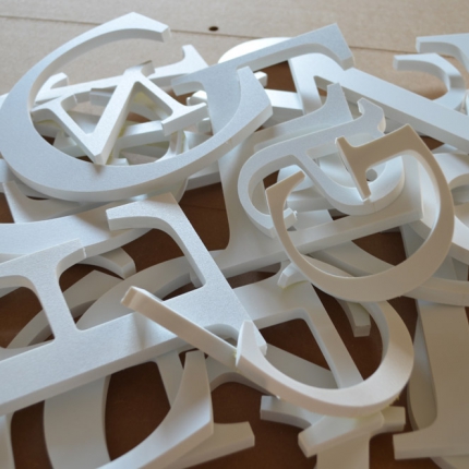 Буквы из белого пластика